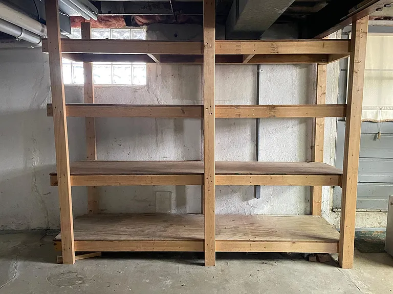 Ample storage shelves in unfinished basement