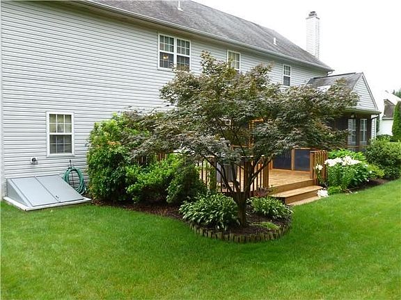 Rear open deck adjoining the screened-in porch