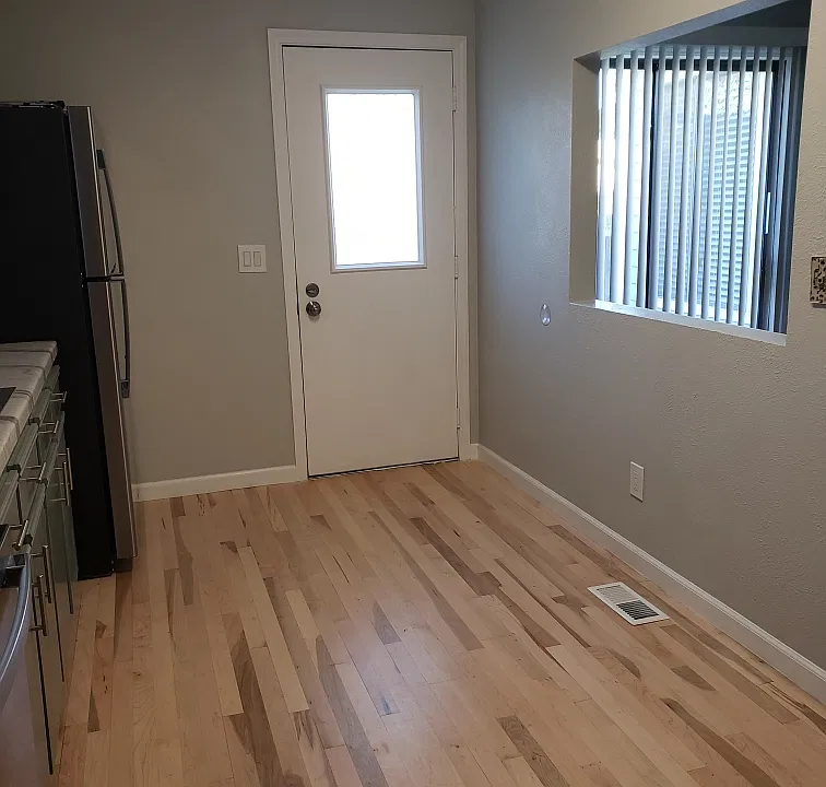 DOOR TO SIDE YARD, FROM KITCHEN.