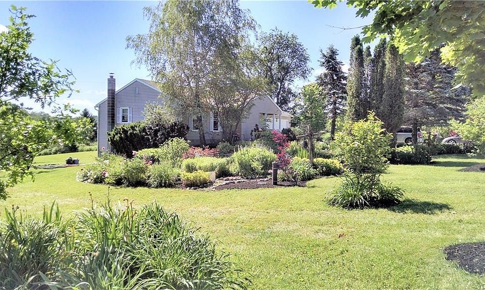 Welcome home to your country paradise!  This inviting and open ranch home sits on a very private 2.94 acres with a small pond!
