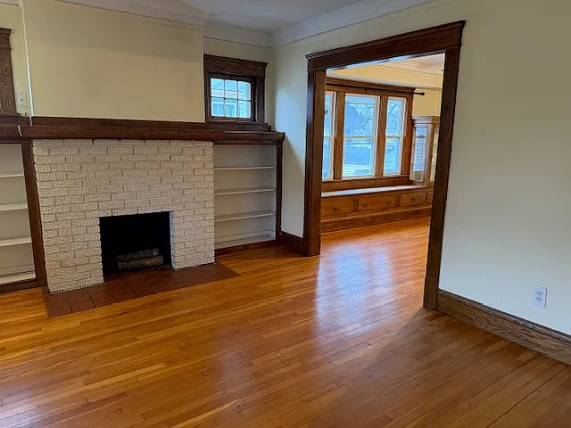 Hardwood floors throughout. In Living room the fireplace is faux by Lakewood policies in duplexes.