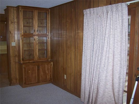 Paneled family room, built in book cases 
