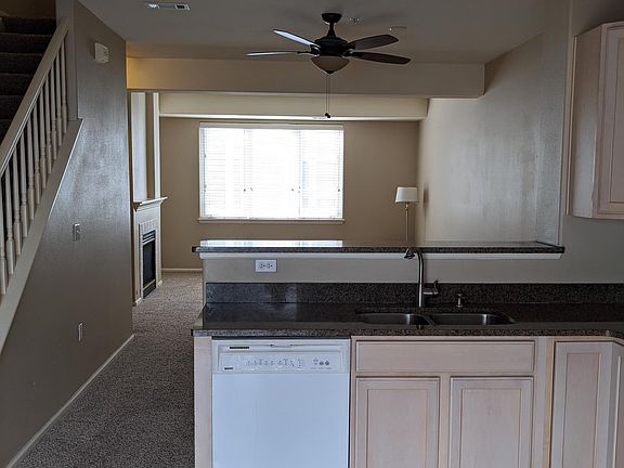 Kitchen view of Den, Staircase to 3rd level