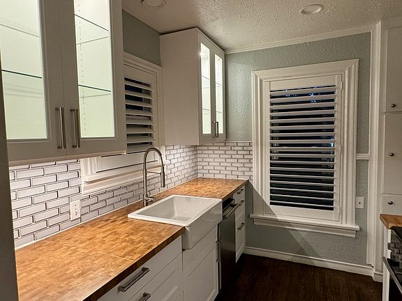 Kitchen with all new appliances, new cabinets and new windows, covered by beautiful custom plantation wood shutters.