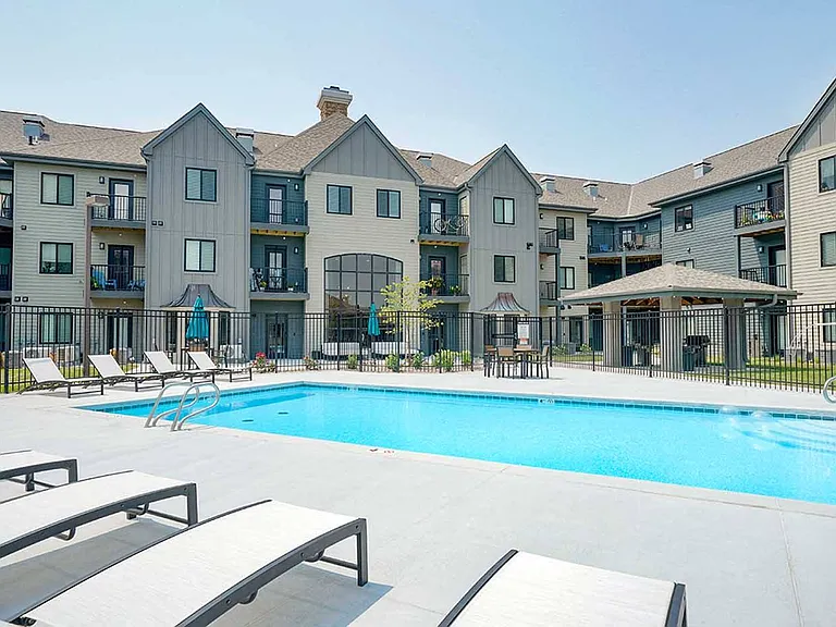 Relax and unwind by our resort-style pool, complete with comfortable lounge chairs and shaded tables.