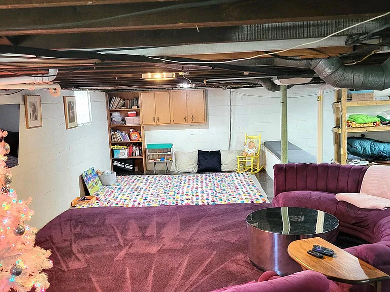 unfinished basement provides storage and entertainment options.