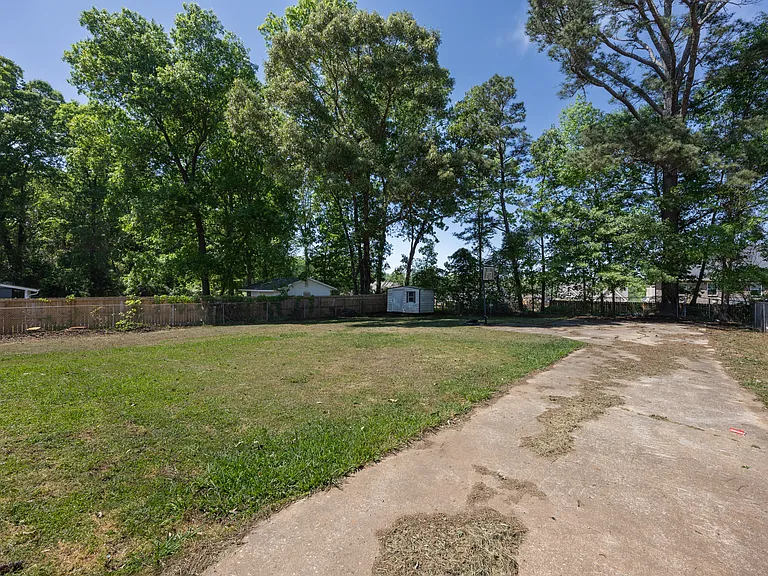 Large fenced-in backyard (black gate on driveway can be closed)
