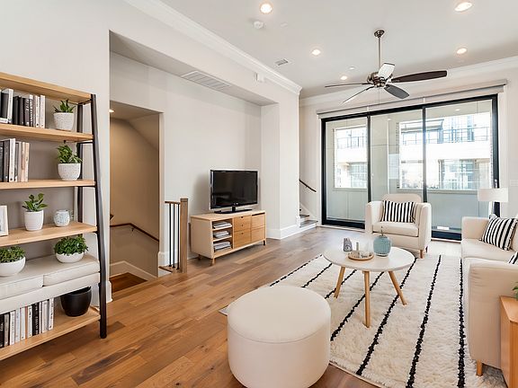 2nd floor living room facing the balcony has been virtually staged for layout and design.