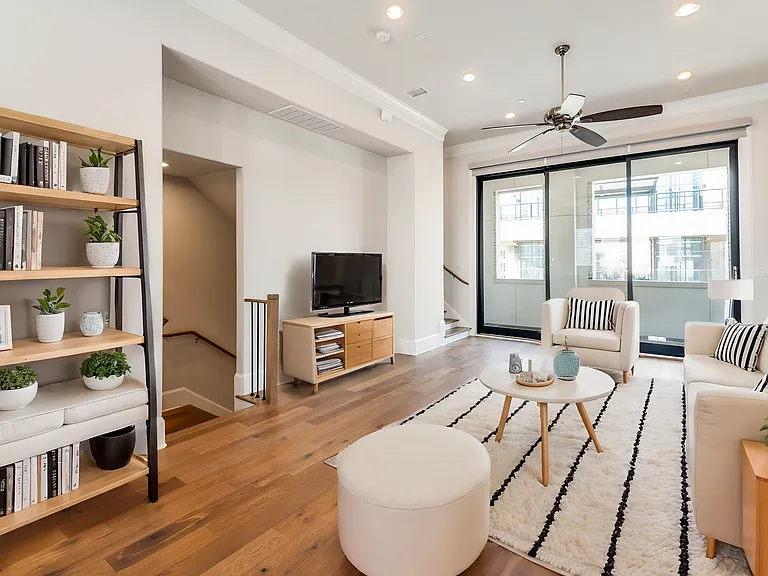 2nd floor living room facing the balcony has been virtually staged for layout and design.