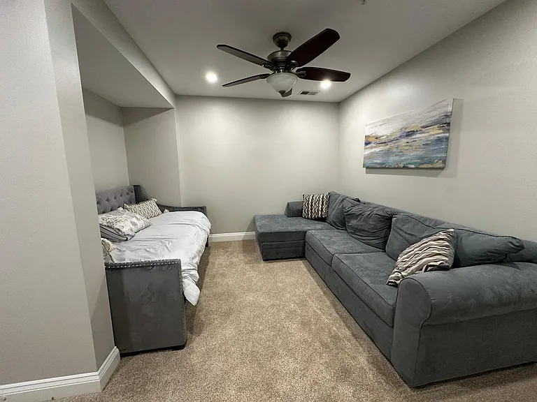 Second floor contains two guest bedrooms, den, one full bathroom,