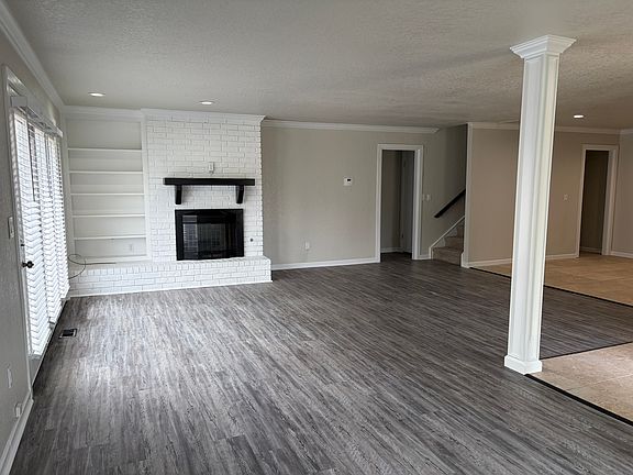 View of living room with fireplace.