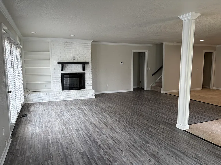 View of living room with fireplace.