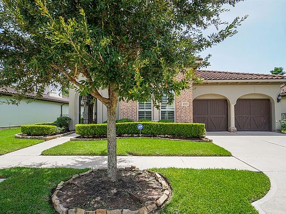 This absolutely gorgeous home is graced by mature tress and manicured landscaping!