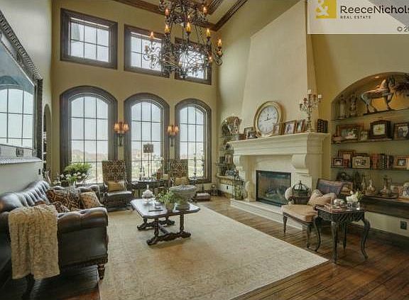 Floor to ceiling "true divided light" windows overlook huge yard