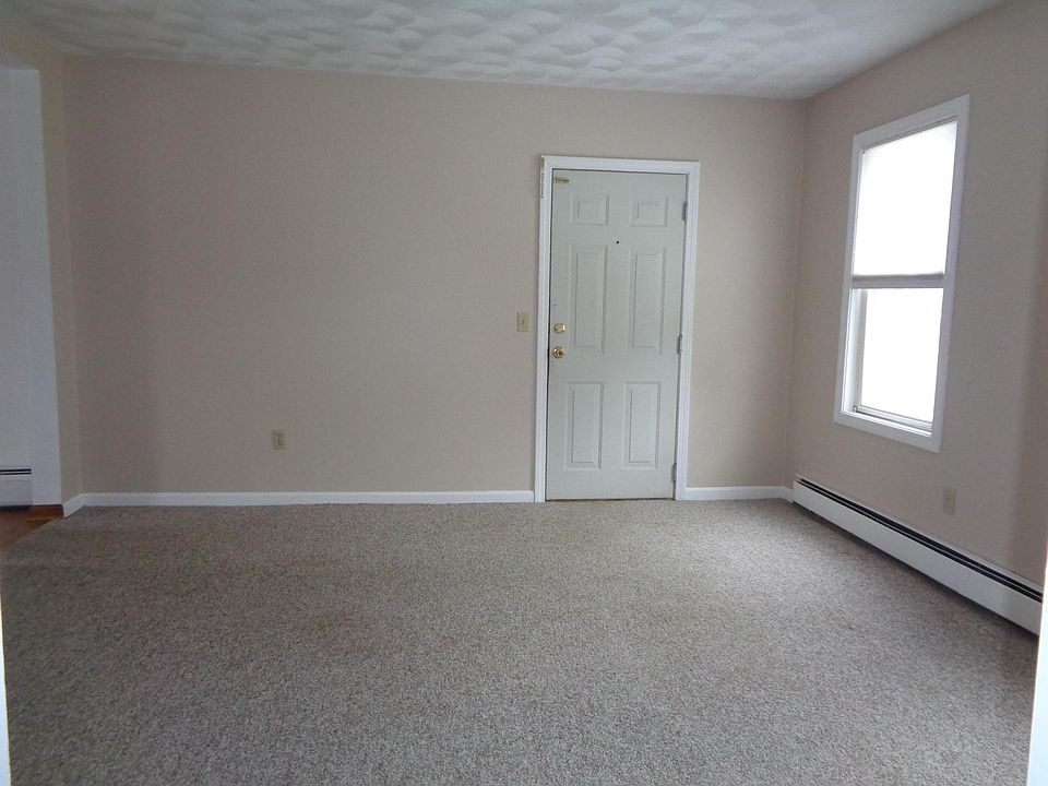 Family Room with entrance door blinds on both windows.