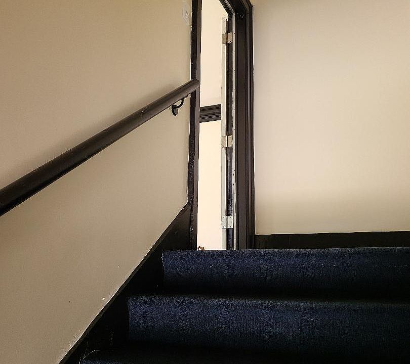 Inside the apartment entrance door.