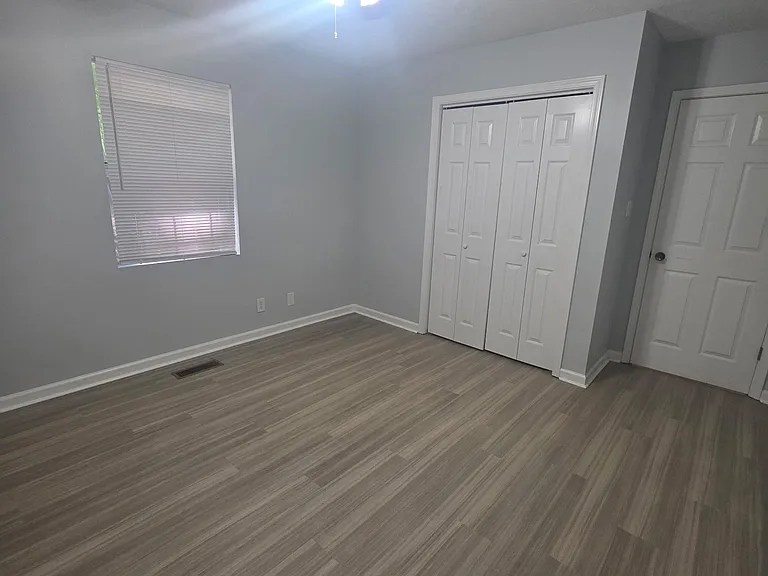 Front bedroom which includes window treatment