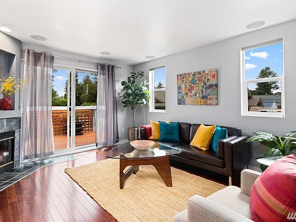 Bright upstairs living room with cozy gas fireplace for snuggling while you watch your favorite show on the large TV.