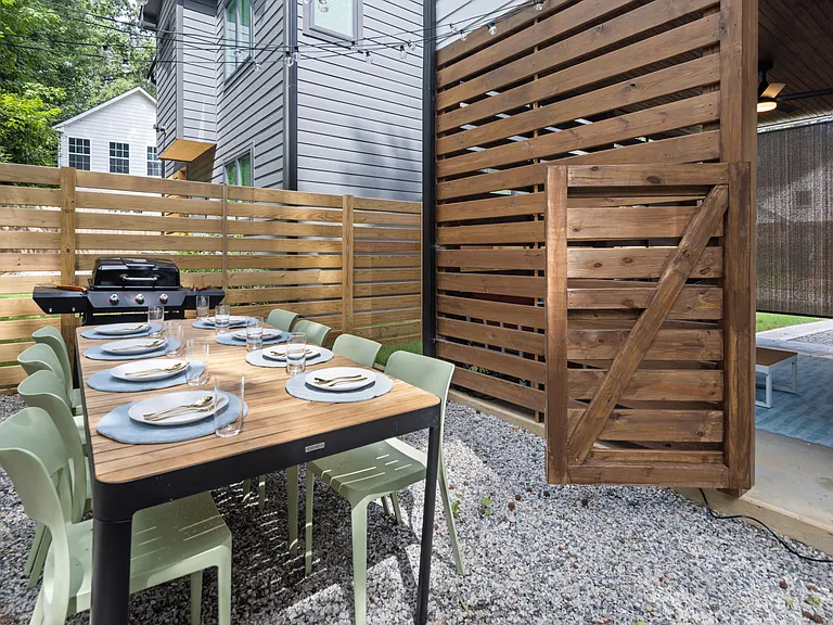 Outdoor dining space with grill