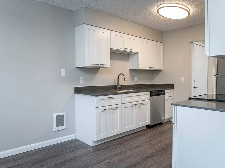 Vantage at Hillsdale | #3 Kitchen with White Cabinetry and Black & Stainless Steel Appliances
