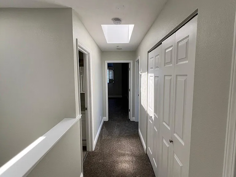 Upstairs hallway with skylight
