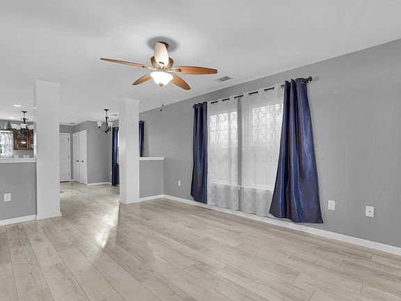large living room adjacent to kitchen