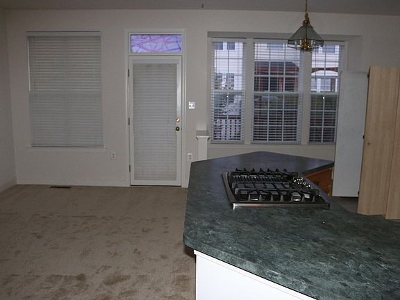 Kitchen flows into family room and opens to deck