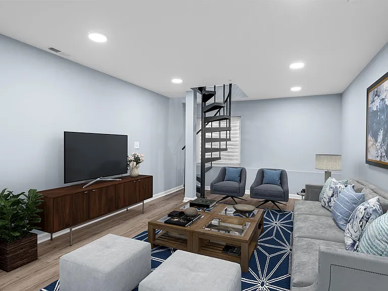 Living space - Lower level. Furniture is virtual staged.