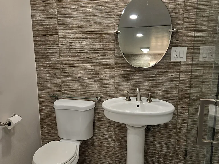 Bathroom Sink, Vanity Light and Toilet