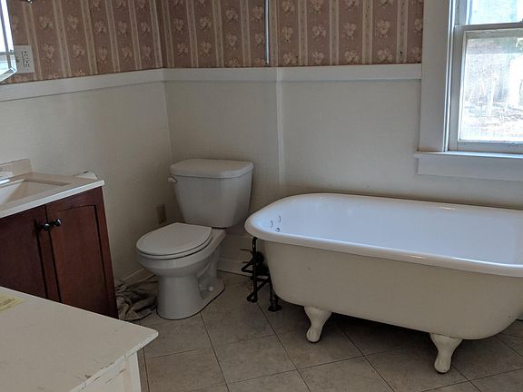Upstairs bathroom with claw foot tub.