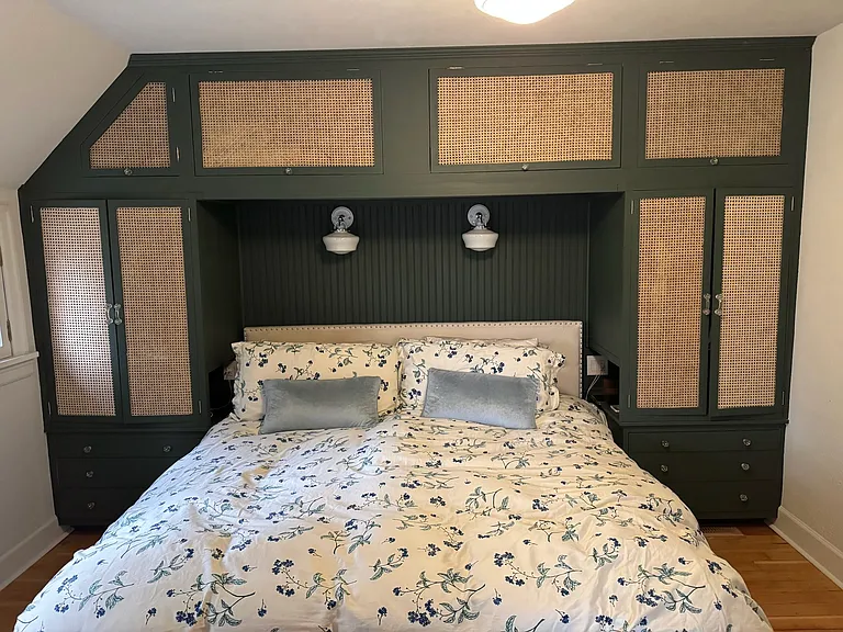 Primary bedroom with built-in cabinets for additional storage. Fits king-sized bed.