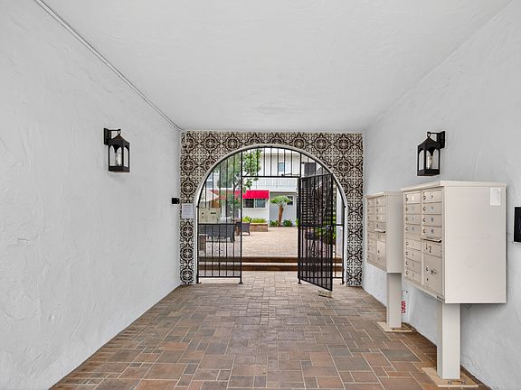 Front security gate and mailboxes.