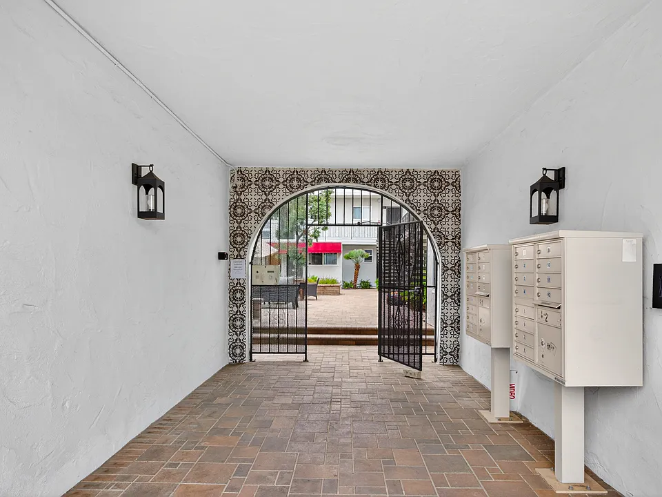 Front security gate and mailboxes.