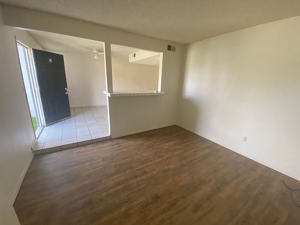 living room looking into dining room and entry