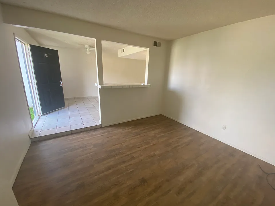 living room looking into dining room and entry