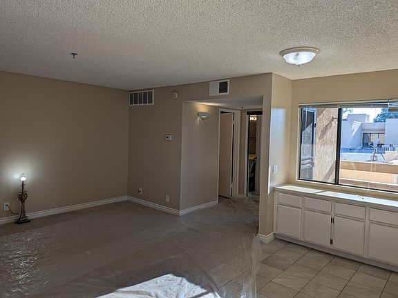 View to bathroom and exit to patio, from kitchen area.
