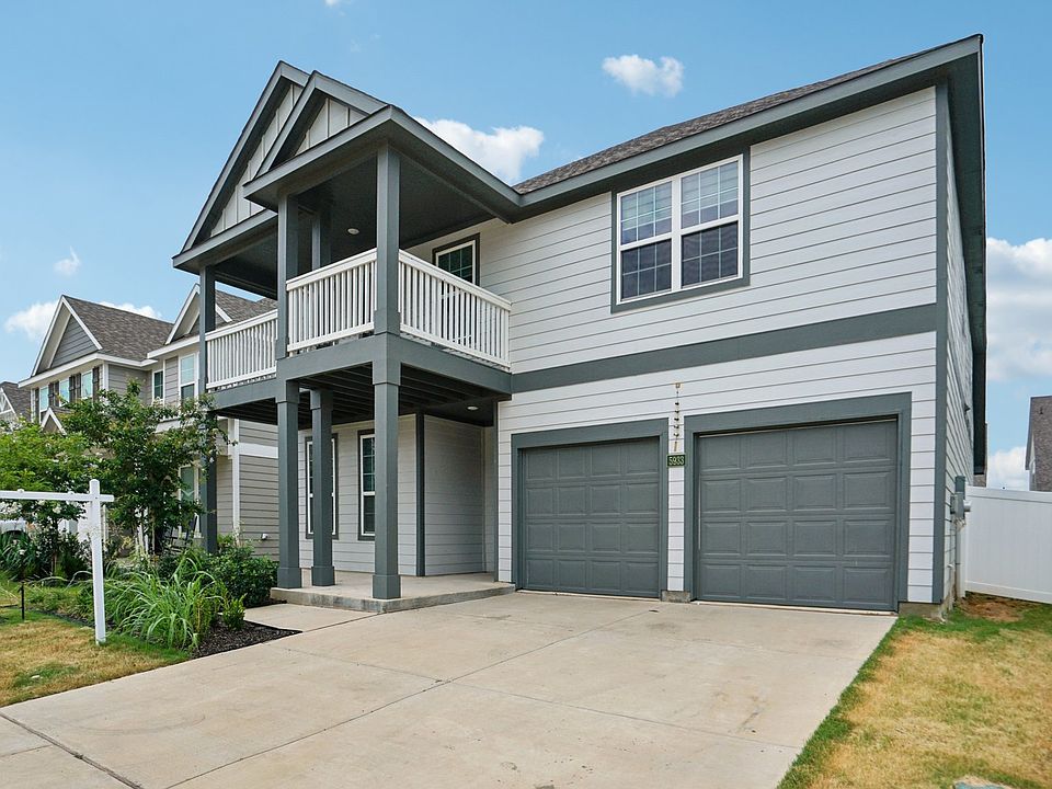 Two car garage and LOVE the front porch and balcony.