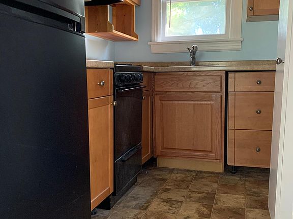 Kitchen with plenty of storage, a gas range and spacious fridge