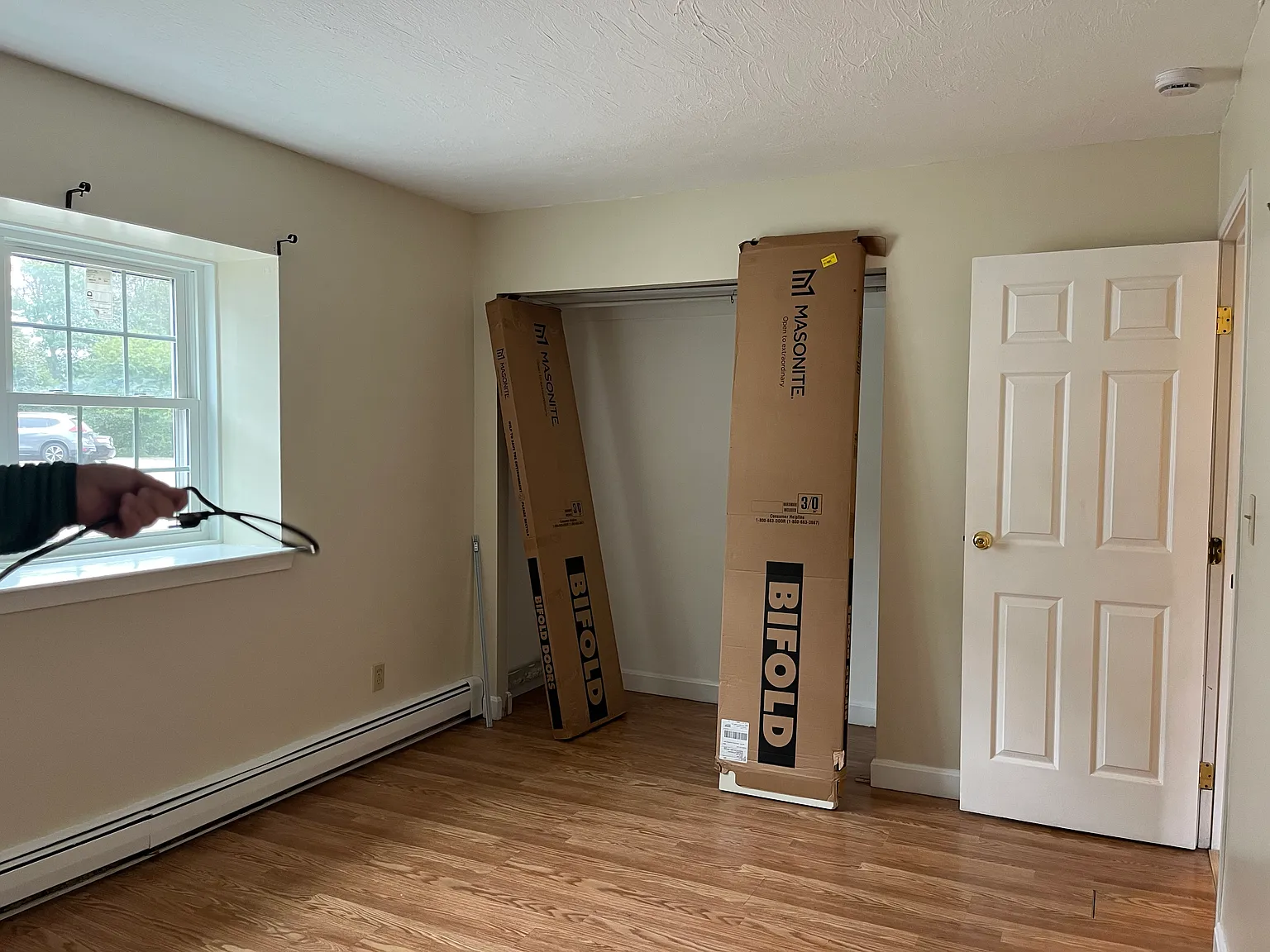 Large bedroom with closet doors to be installed