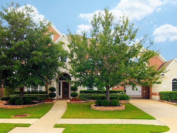 -Stone Elevation with Custom cast stone detail around front windows-Extensive Landscape /Lighting-Sprinkler System