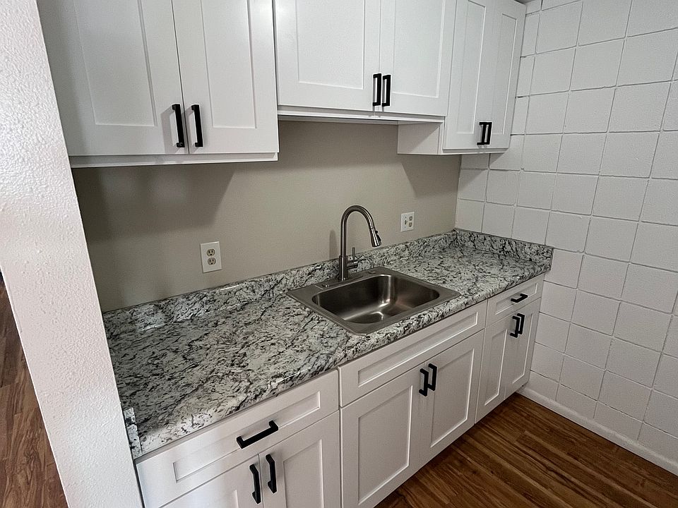 Newly renovated kitchen with brand new cabinets, sink and counters.