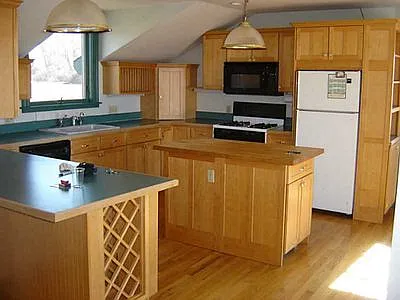 Open kitchen concept. Lots of cabinet space and a view to the water. dinning availbe in kitchen as well