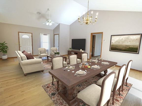 Dining room / living room area with hardwood floors. NOTE: virtually edited furniture.