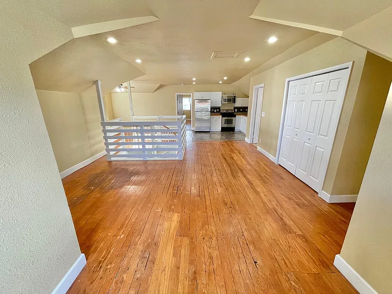 Living area /bi fold doors on the right with the washer/dryer behind them
