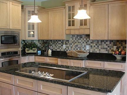 Gorgeous kitchen w/ceramic backsplash.