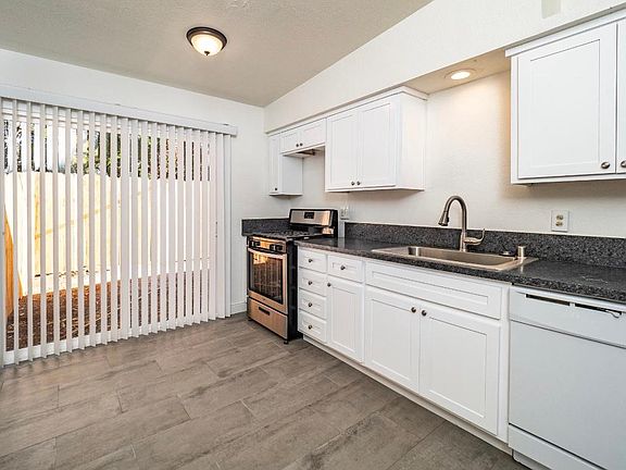 eat in kitchen with back fenced yard