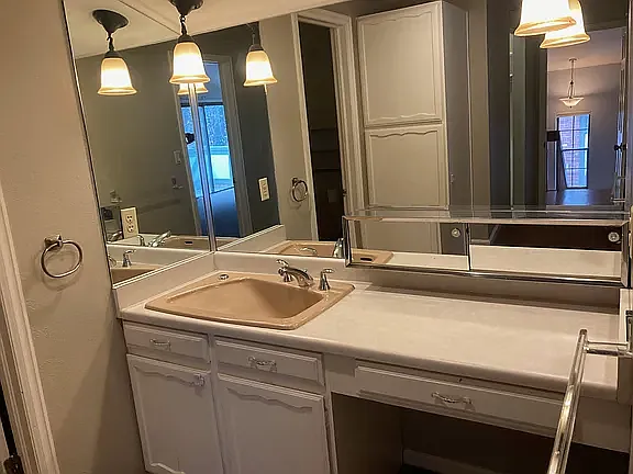 Powder room featuring vessel sink.
