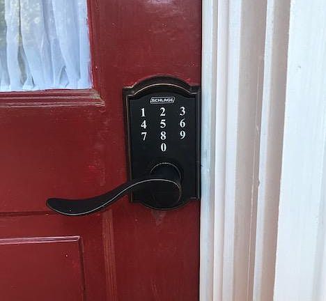 coded entry into units is located on the red door under the screened porch for privacy and protection from weather when entering .