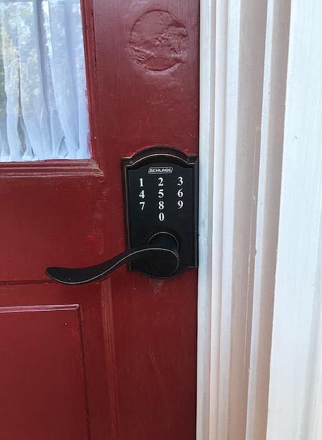 coded entry into units is located on the red door under the screened porch for privacy and protection from weather when entering .