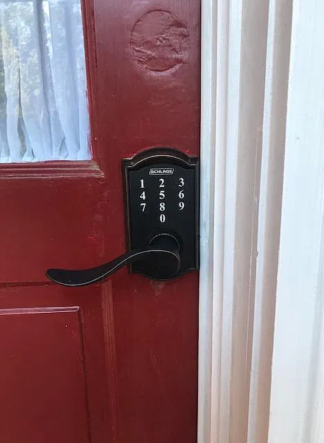 coded entry into units is located on the red door under the screened porch for privacy and protection from weather when entering .